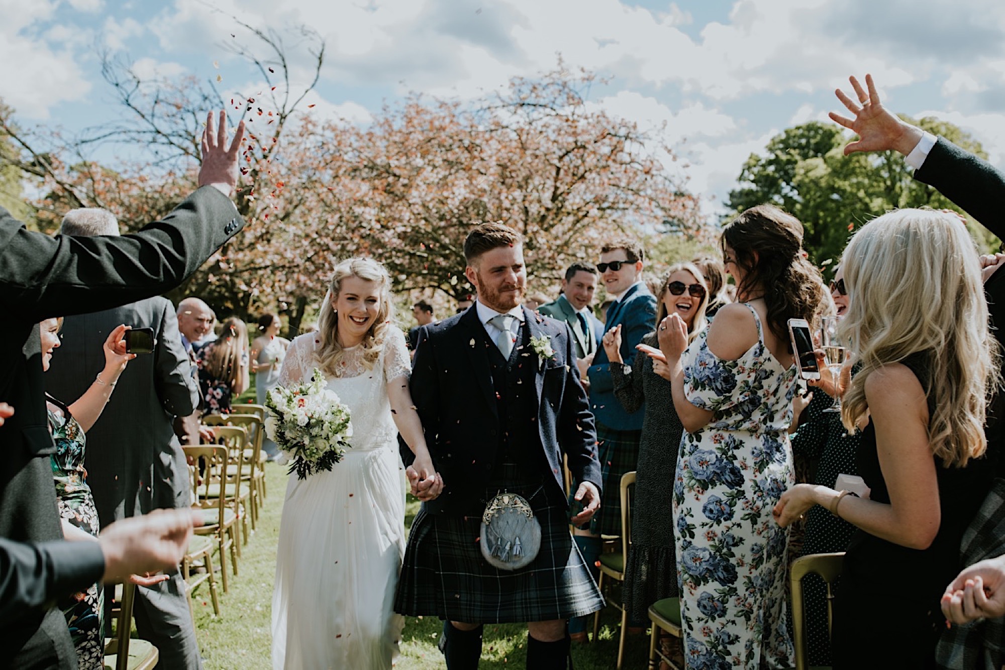 outdoor summer wedding ceremony at kirknewton stables edinburgh rustic barn venue