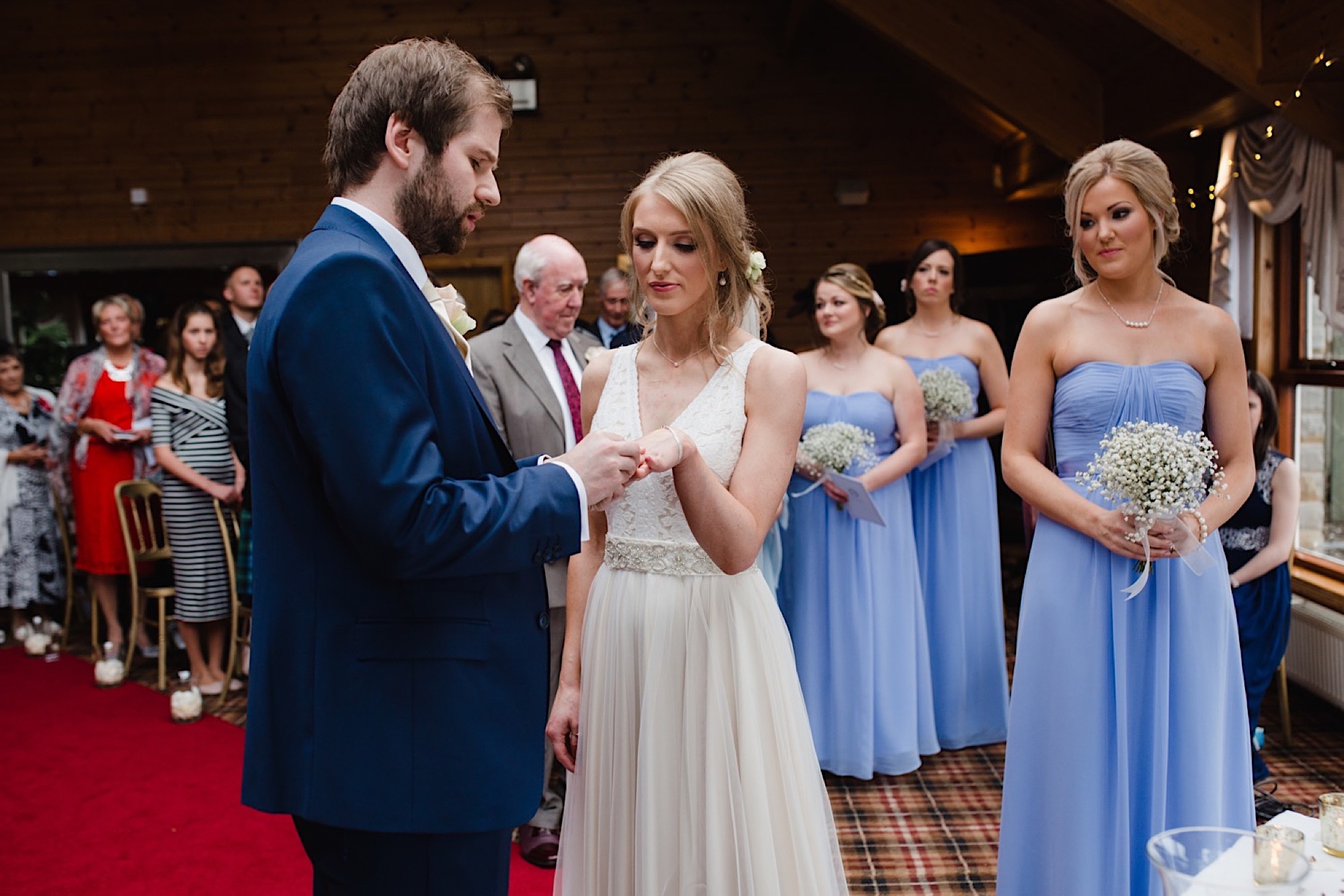 bride and groom exchanging wedding rings
