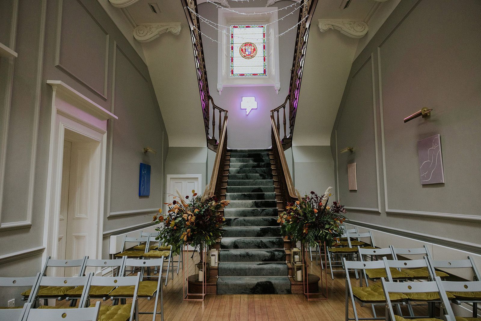 neterbyres house wedding venue grand hall set up with chairs and floral decor for ceremony
